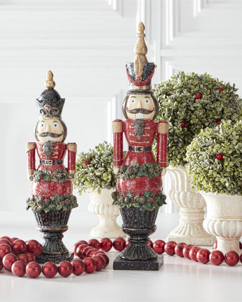 Resin Glittered Nutcrackers on Black Pedestals Set